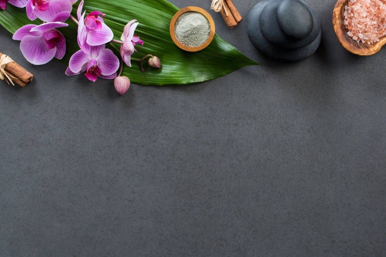 A black table with some flowers and other items